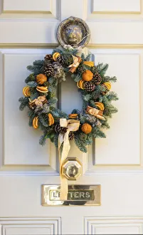 A Christmas wreath on the front door of a house in Bath, Somerset, England