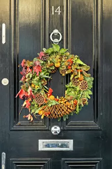 Images Dated 5th January 2023: Christmas wreath on a door in Kensington, London, England, UK