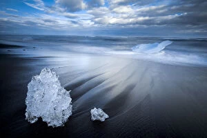 Frozen Gallery: Chunks of ice on shore at Diamond beach near Jokulsarlon glacier lagoon, South Iceland