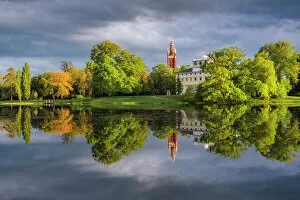 Images Dated 27th January 2023: Church, castle and deciduous trees reflected in the lake Worlitz, Dessau-Worlitzer Garden Realm