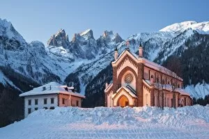 Peaks Gallery: The church of Falcade, with Focobon peaks in the background, in wintertime, Dolomites