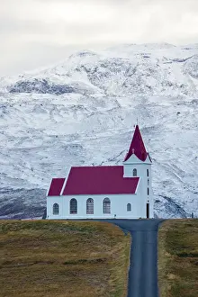 Icon Prints: Church of Ingjaldsholskirkja with the snow-capped mountains behind it, Iceland