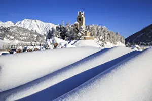 Canton Graubunden Prints: The church of San Gian surrounded by snow dunes. Celerina. Engadine. Canton of Graubunden
