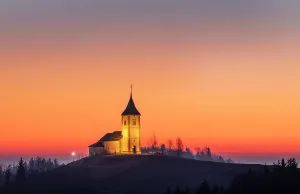 Church Of St Prints: Church of St. Primoz and Felician against a red sky at dawn, in winter, Jamnik, Slovenia