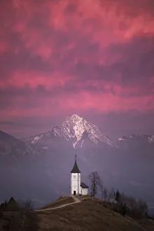 Church of St. Primoz and Storzic Mountain at sunset, Jamnik, Slovenia