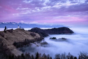 Images Dated 26th June 2023: Church of St. Primoz and Storzic Mountain at sunset, Jamnik, Slovenia