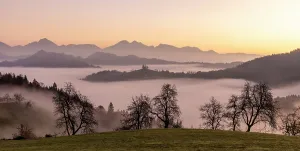 Above The Clouds Prints: Church of St. Thomas and the Kamink Savinja Alps at sunrise
