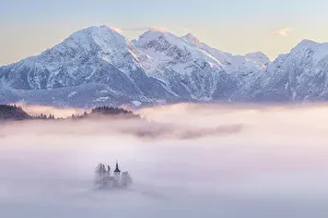 Church Of St Prints: Church of St. Thomas and the Kamink Savinja Alps in winter, Skofja Loka, Slovenia