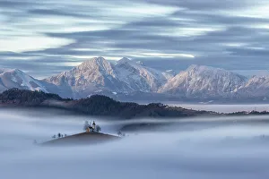Moonlight Prints: Church of St. Thomas and the Kamnik Alps at night lit by the full moon