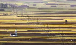 Power Prints: Church of St. Ursula, electricity pylons and arable field patterns, Ljubljana Basin