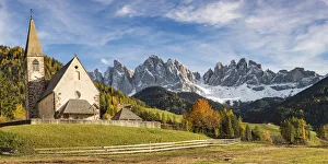 The church of the village with Odle Dolomites peaks on the background. Santa Maddalena The church of the village with Odle Dolomites peaks on the background. Santa Maddalena