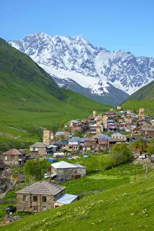 Western Asia Gallery: Chvibiani and Zhibiani with snow-covered Shkhara peak in background, Ushguli