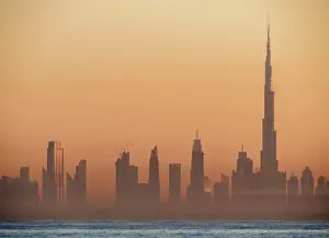 Persian Gulf Prints: City Centre Skyline seen from Palm Jumeirah artificial island at sunrise, Dubai