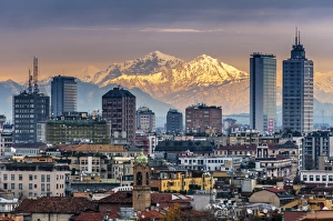 City skyline at sunset with the snowy Alps in the background, Milan, Lombardy, Italy
