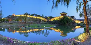 City Walls Prints: City walls and Banghwasuryujeong Pavilion of Hwaseong Fortress (UNESCO World Heritage Site)at dusk