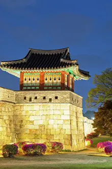 City Walls Prints: City walls and watchtower of Hwaseong Fortress (UNESCO World Heritage Site) at dusk