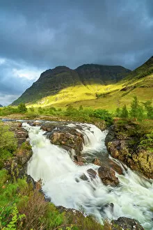 A Charnaich Collection: Clachaig Falls on Coe river against cloudy sky, Glencoe, Scottish Highlands, Scotland, UK