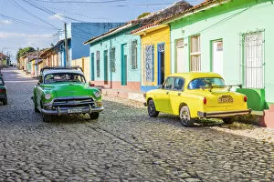 Cuban Gallery: A classic car driving in a street in Trinidad, Sancti Spiritus, Cuba