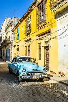 Habana Prints: Classic car in a narrow street in La Habana Vieja (Old Town), Havana, Cuba
