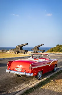 Habana Prints: Classic car parked near canons from El Morro, Regla Province, Havana, Cuba