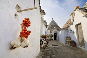 Classic Italian foreshortening in Alberobello, with Trulli, Garlic and Cherry tomatoes