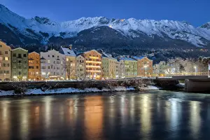Marktplatz Prints: The classic view of the snow covered Mariahilf buildings with the Nordkette mountains in
