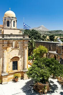 Images Dated 22nd April 2022: Clear sky over the dome and Greek flag hanging on ancient Agia Triada of Tzagarolon monastery