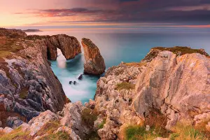 Cliff landscape with rock needle and rock arch called Pena Flecha- Spain, Asturias, Oriente, Ribadesella, Bufones de Pria - Bay of Biscay, Costa Verde