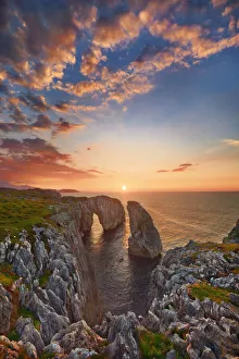 Cloud Gallery: Cliff landscape with rock needle and rock arch - Spain, Asturias, Oriente, Ribadesella