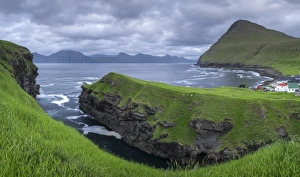 Cliff Top Prints: Cliff top view over the gorge at Gjogv towards the island of Kalsoy