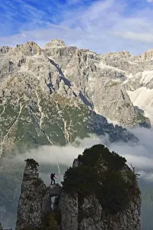 Climber Prints: Climber on a rock tower of the Croda Rossa overlooking the Dreischusterspitze, Alta