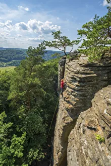 Climbers on rock formations near Berdorf, MAollerthal, Kanton Echternach, Luxembourg