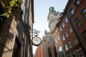 Images Dated 24th February 2010: Clock outside shop & The clocktower of Storkyrkan (The Great Church), Gamla Stan