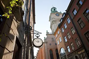 Clock outside shop & The clocktower of Storkyrkan (The Great Church), Gamla Stan