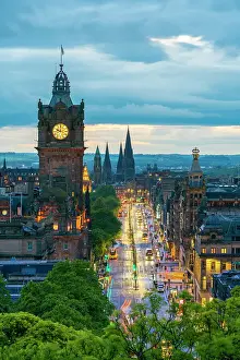 Clock tower of Balmoral Hotel, high angle view of Princes Street and St Marys Cathedral in background at dusk, UNESCO, Old Town, Edinburgh, Lothian, Scotland, UK