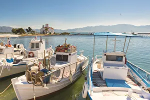 Elafonissos Prints: Close up of fishing boats at Elafonissos harbour and church of St