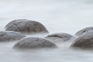 Close-up of Moeraki Boulders washed by the ocean, Hampden, North Otago, South Island
