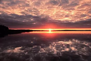 Saskatchewan Collection: Clouds refelected in Namekus Lake at sunrise Prince Albert National Park Saskatchewan, Canada