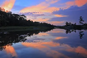 Symmetry Prints: Clouds reflected in Middle Lake at dawn Kenora, Ontario, Canada