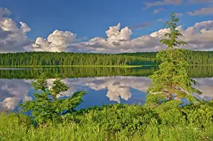 CLouds reflected in Trail Lake. Hwy 105 North of Vermillion Bay, Ontario, Canada