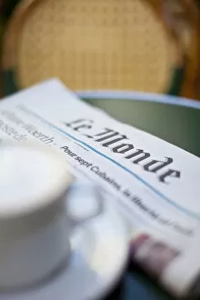 Coffee and newspaper in a cafe, Paris, France