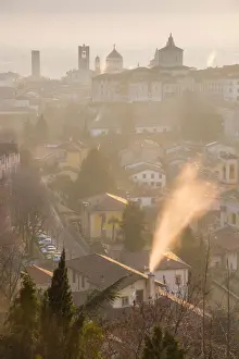 Upper Town Prints: A cold morning in Bergamo upper town with some fog and smoke from the chimneys