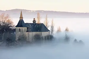 Limousin Prints: Colla giale Notre Dame et St Pantala on de Turenne in the mist at sunset, Correze