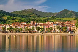 Images Dated 1st July 2022: Collioure reflecting in bay, Pyrenees Orientales, Occitanie Region, France