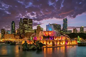 Fountain Prints: Colored-light show at Buckingham Fountain with city skyline in the backdrop