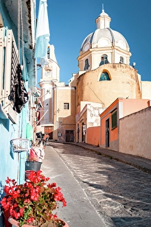 Catholicism Prints: Colorful houses and church in the uphill alleys