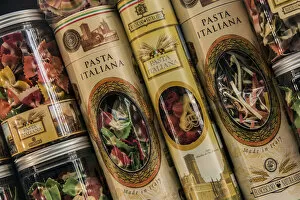 Neighborhood Collection: Colorful Italian pasta tin packaging containers on sale in a drugstore of Trastevere