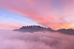 Colorful sunrise over Monte Resegone in a foggy morning. Lecco, Brianza, Lombardy, Italy