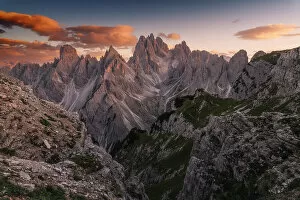 Calm Gallery: A colorful sunset over the Cadini di Misurina on a windy summer evening. Dolomites, Italy