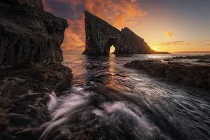 Faroese Prints: Colorful sunset behind the cliffs of Drangarnir after the storm cleared